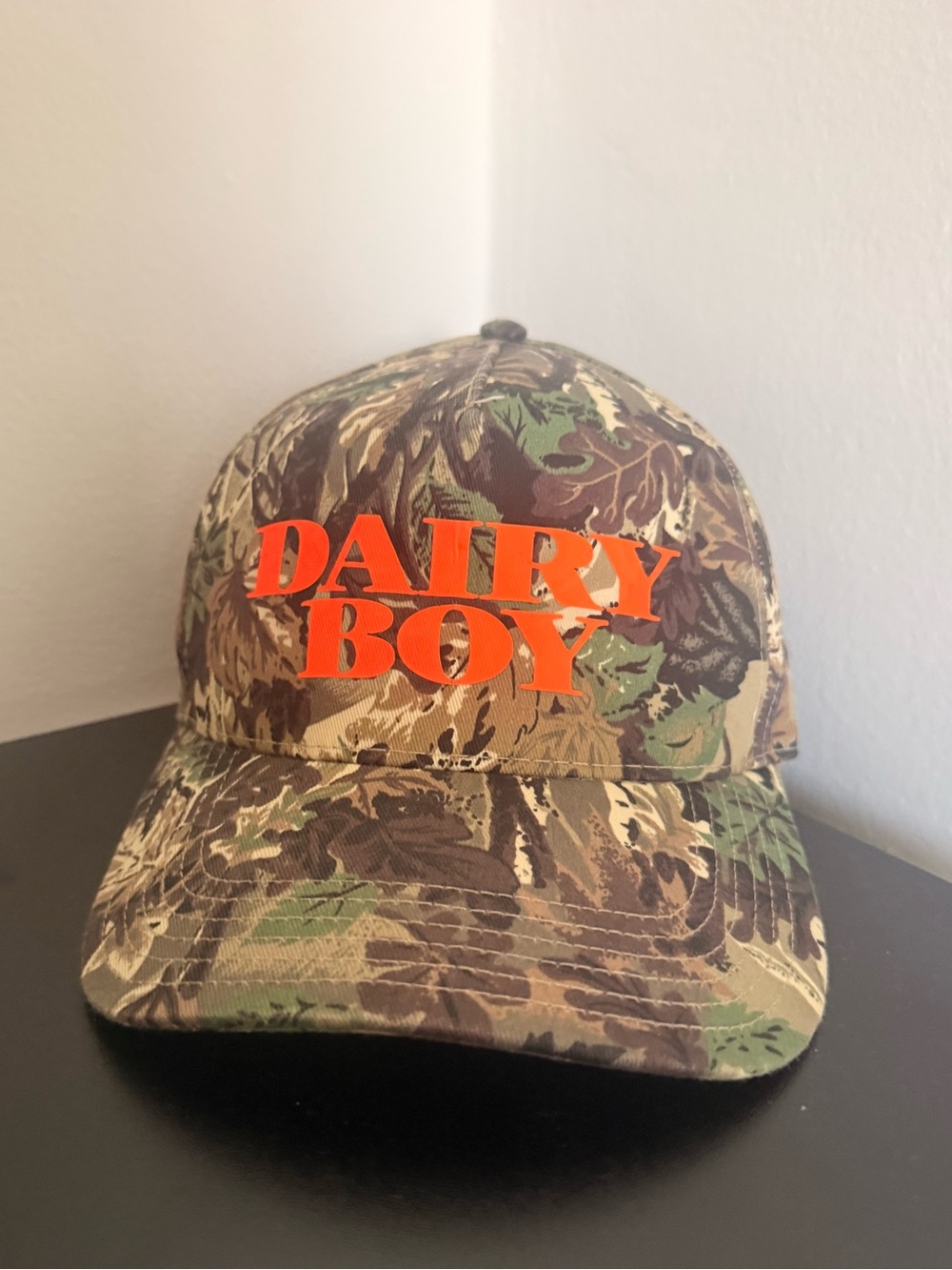 DAIRY BOY Camo Cap with Orange Logo